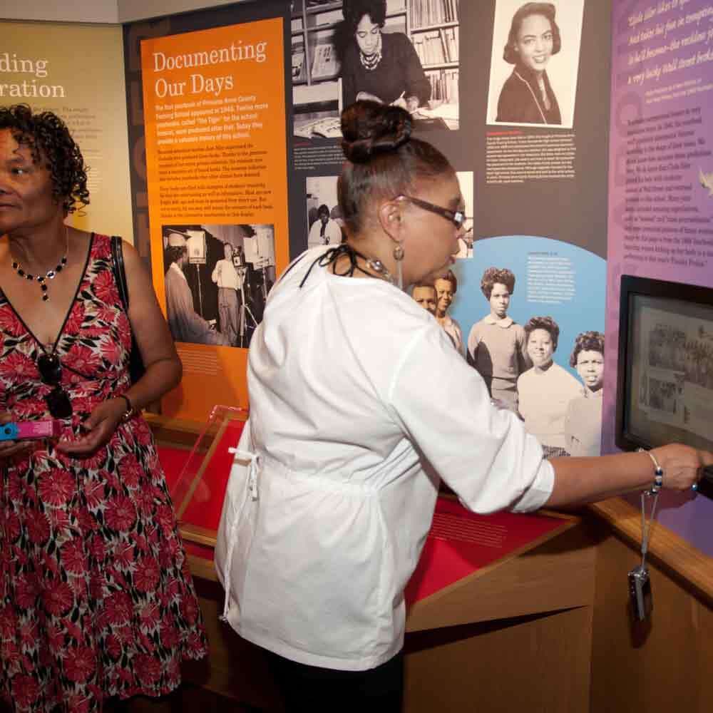Visitor Using Touchscreen to Learn More About a Display